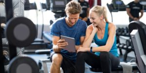 Personal Trainer and client looking at healthy recipes